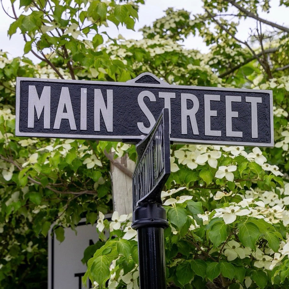 A classic street-side sign for Blowing Rock, North Carolina, marking the entrance to the charming Main Street area we explore on our history tour.